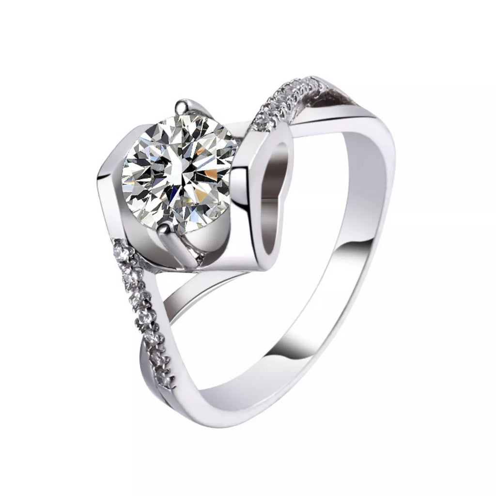 925 sterling silver moissanite ring showing round center stone and prong setting