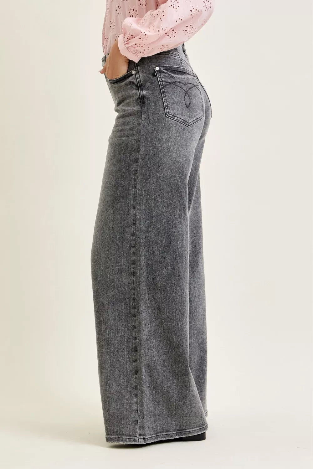 Gray denim palazzo jeans, mid-rise back yoke with curved stitching and flap pockets