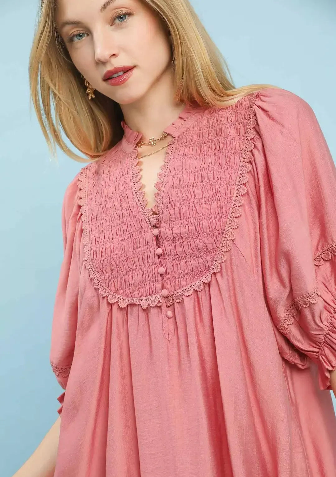 Smocked bib babydoll dress in BLUSH with lace trim neckline and button placket