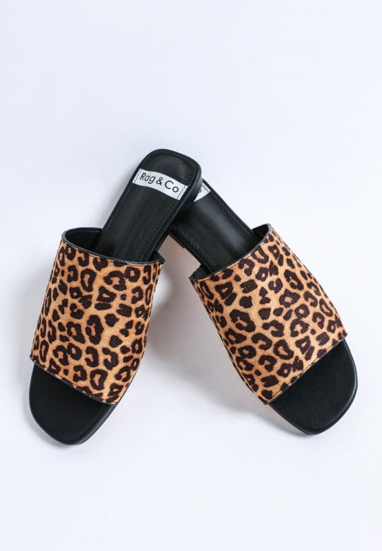 Leopard print slide sandals with black straps and open square toe