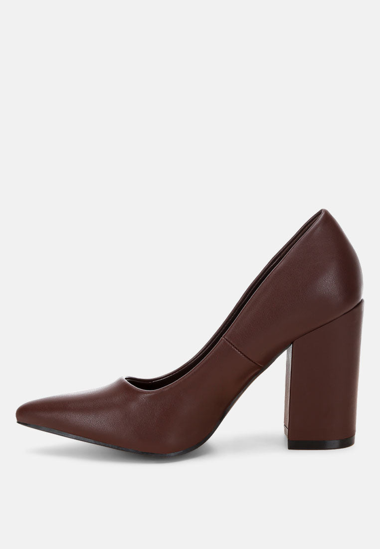 Brown faux leather pumps with pointed toe and tall block heel, angled view