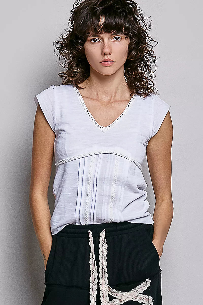 Off-white V-neck short-sleeve knit top with textured fabric and lace neckline trim
