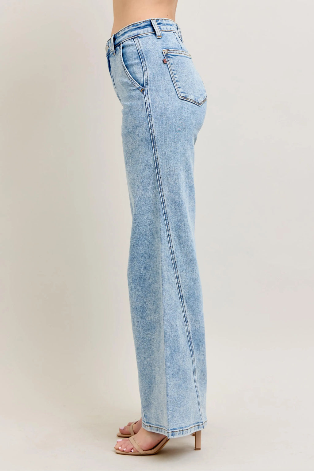 Light wash wide-leg jeans, side view with back yoke and slanted back pocket