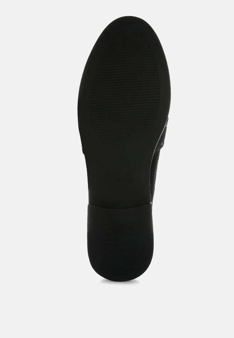 Black velvet loafer outsole view, textured sole with low heel