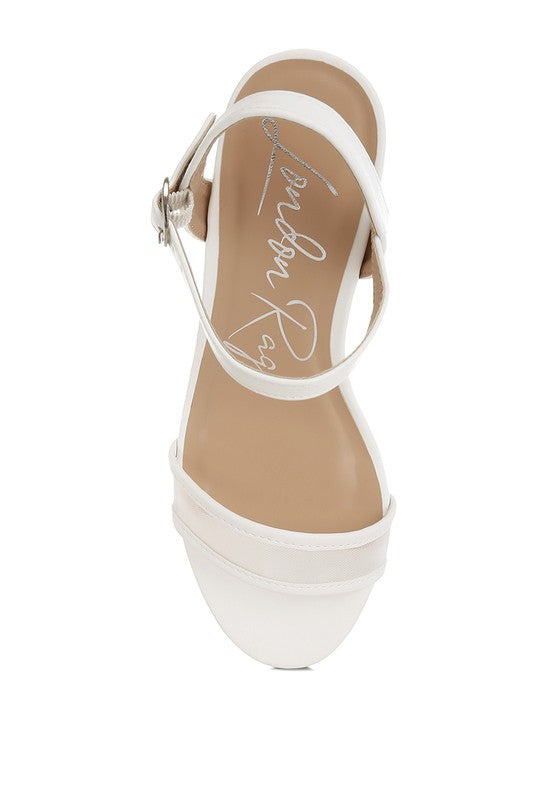 White strappy block heels with ankle pin-buckle strap