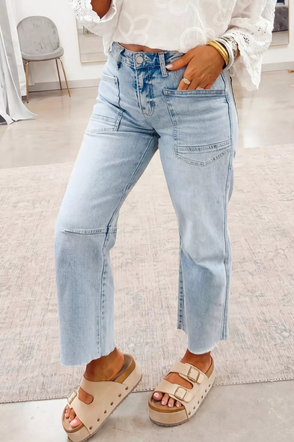 Light wash utility pocket straight-leg jeans in light blue denim, button fly and pockets