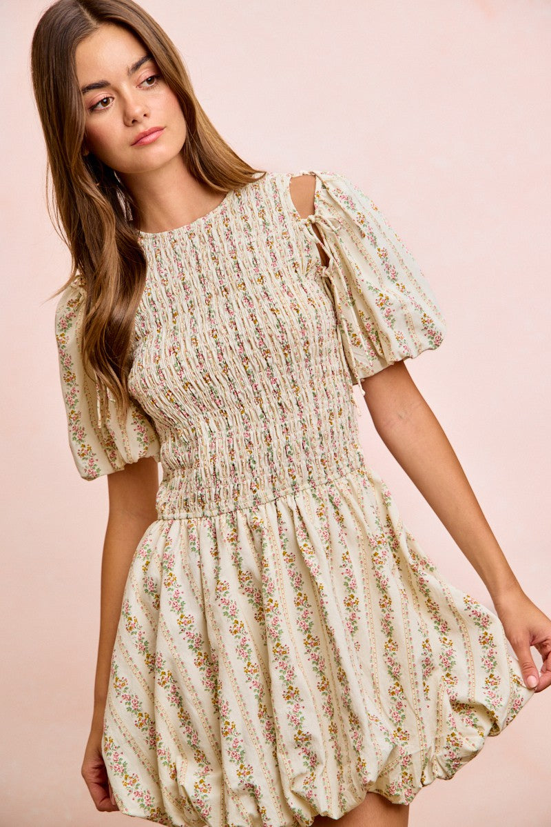 Ivory floral puff sleeve mini dress with ruffled hem and smocked chest detail