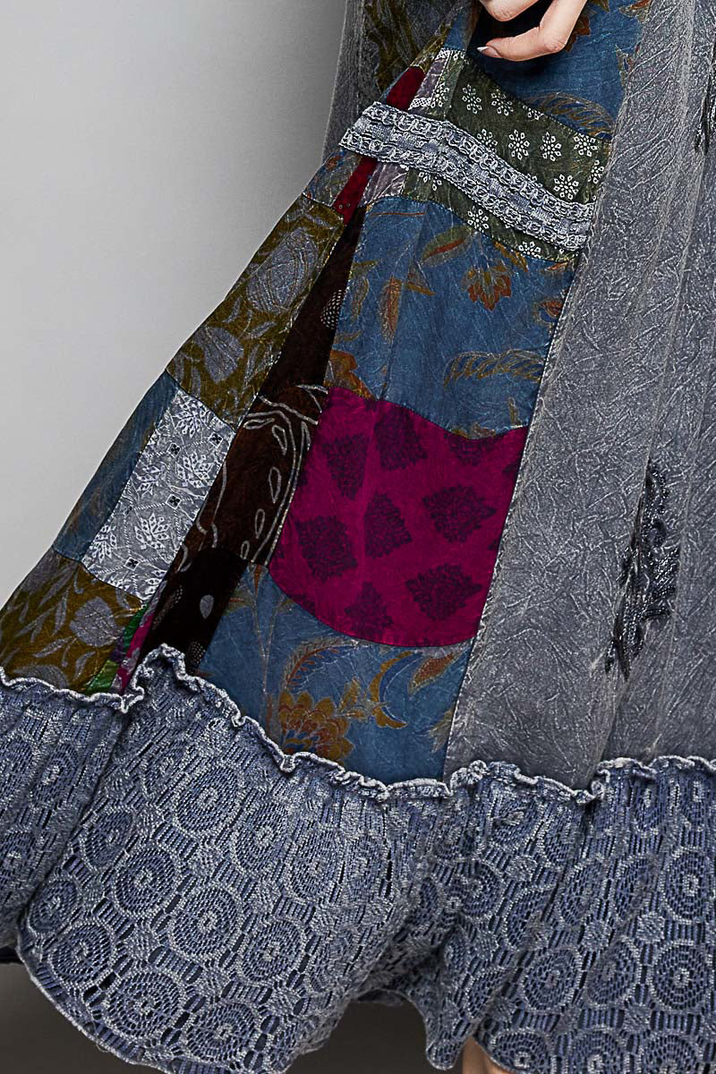 Charcoal Multi patchwork skirt close-up: colorful blocks, decorative stitching, fringe