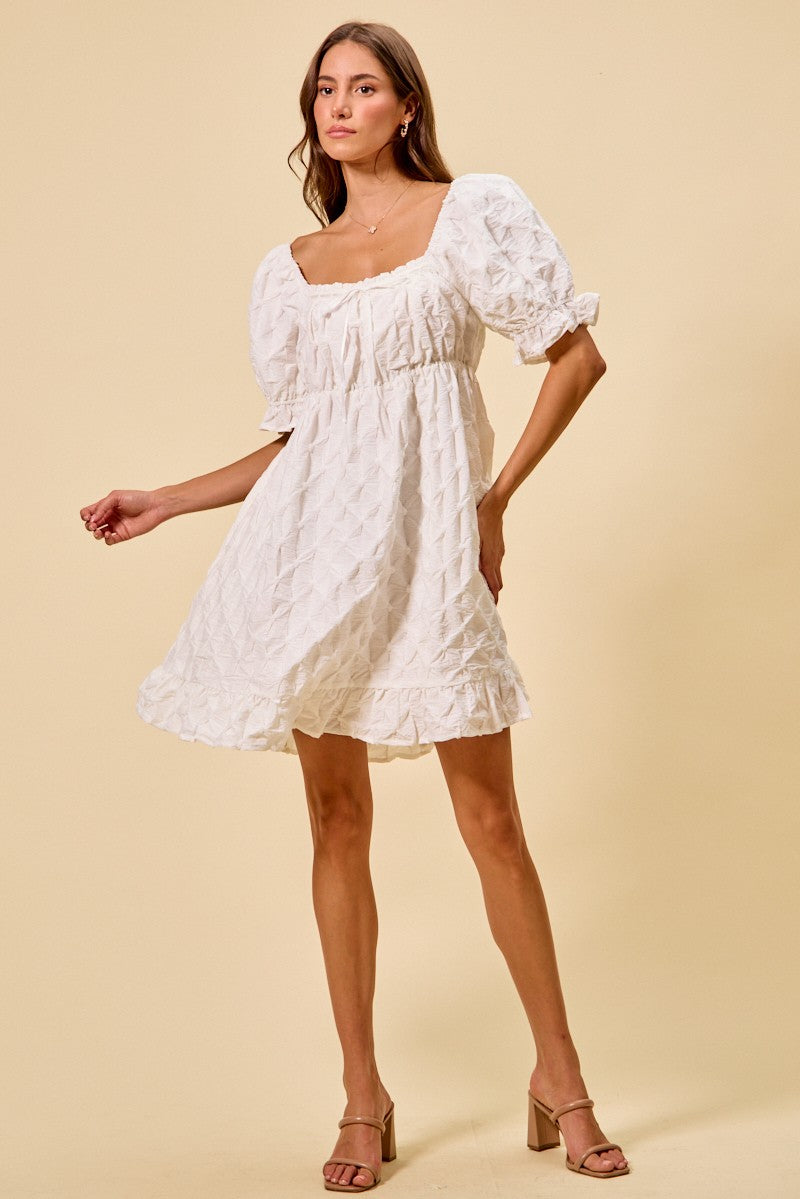 Off-white mini dress with gathered waist, textured woven fabric, ruffled hem and puff sleeves