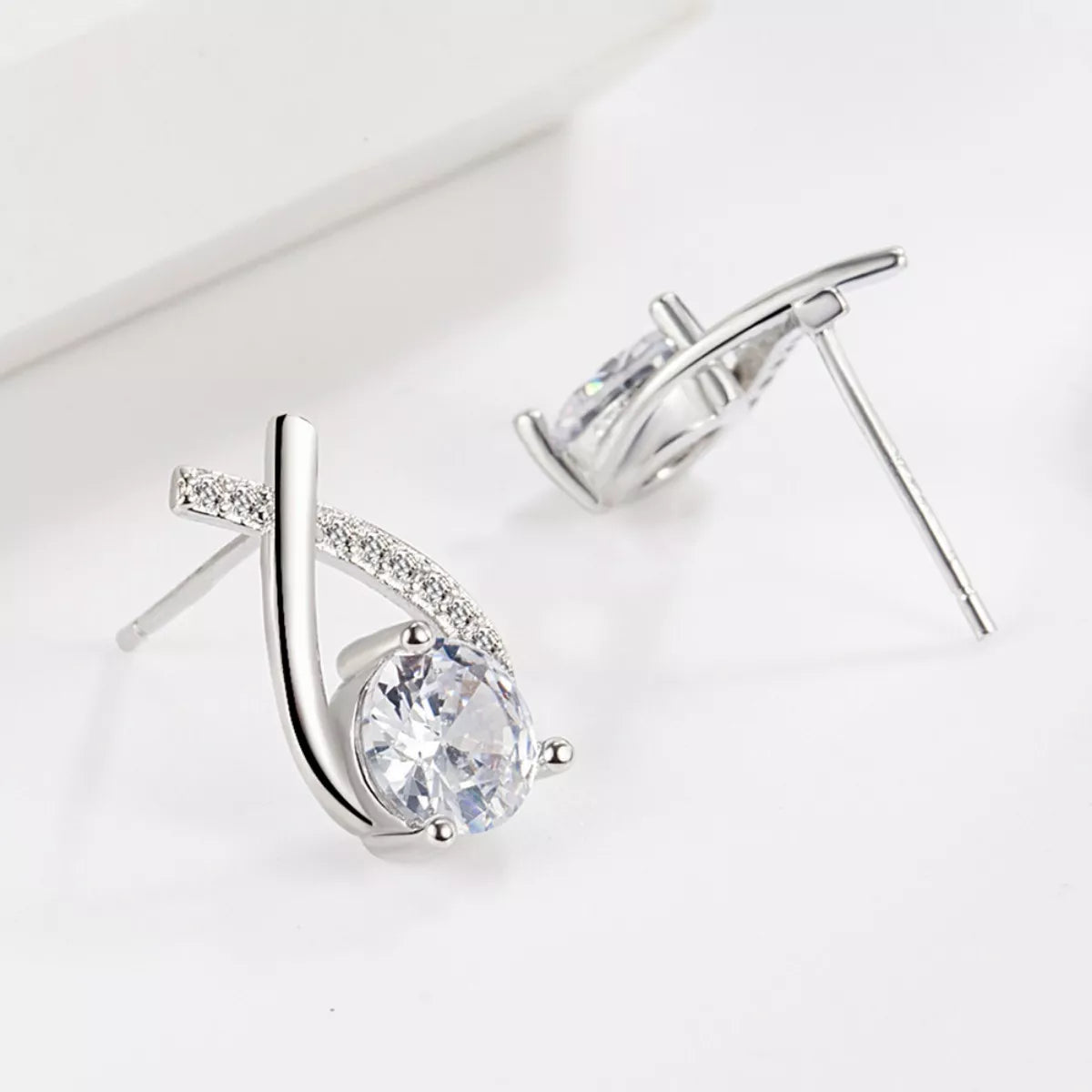 Sterling silver moissanite teardrop earrings with stud back and post closure