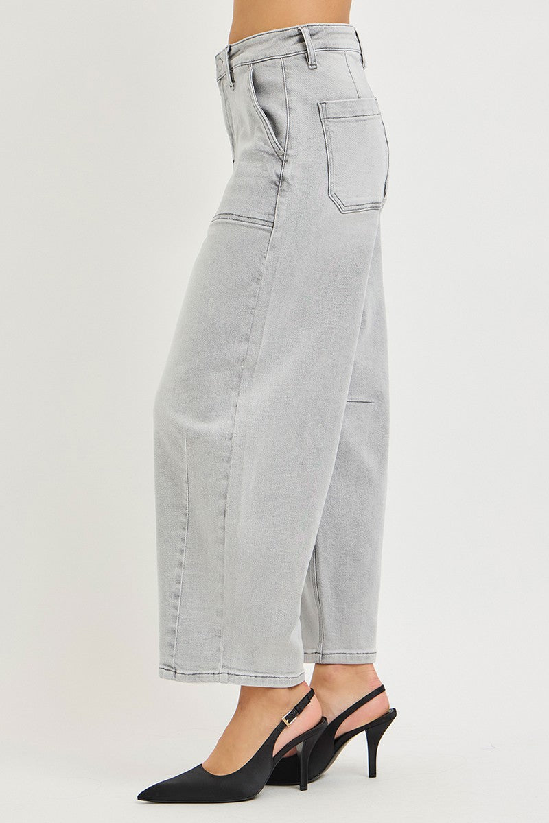 Light grey cropped barrel jeans three-quarter view, patch pockets, cuffed hem, angled seams