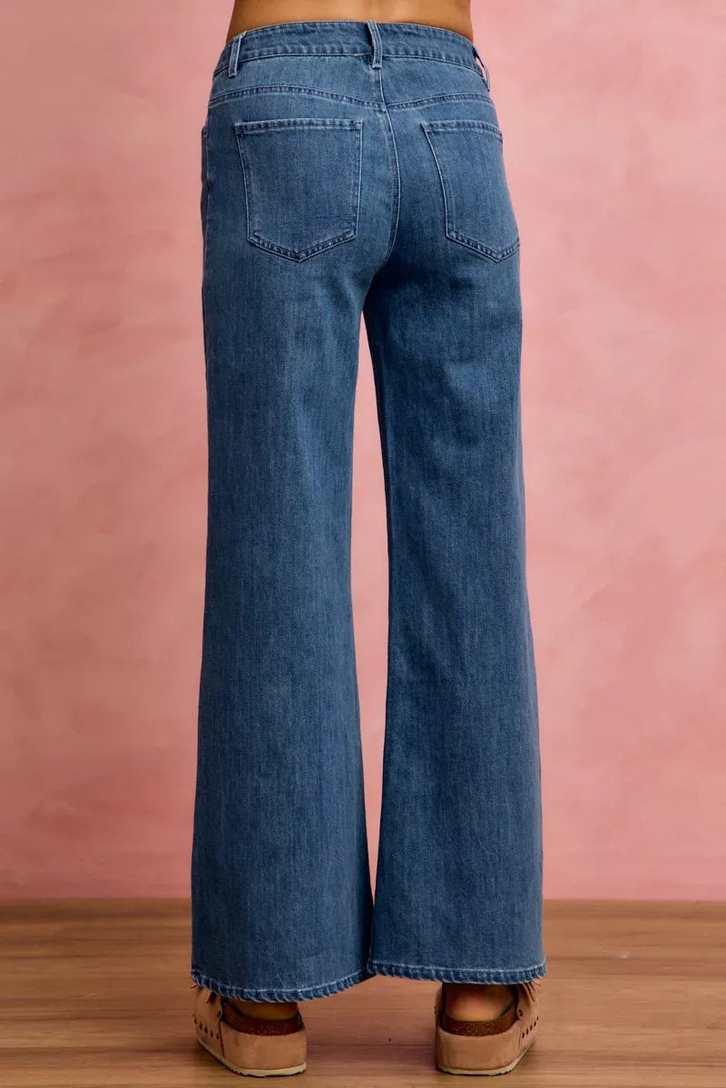 SO ME denim jeans, mid-rise wide-leg silhouette with back patch pockets and belt loops.