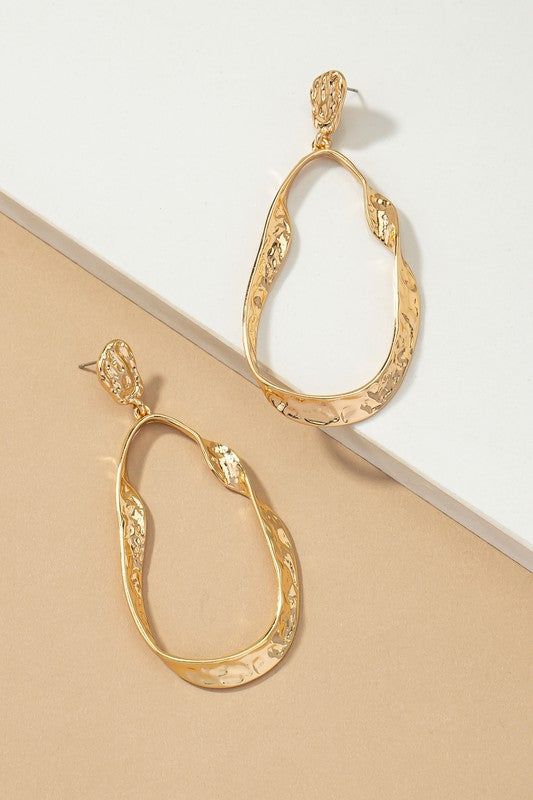 Gold hammered twisted metal hoop earrings, oval teardrop shape (one size)