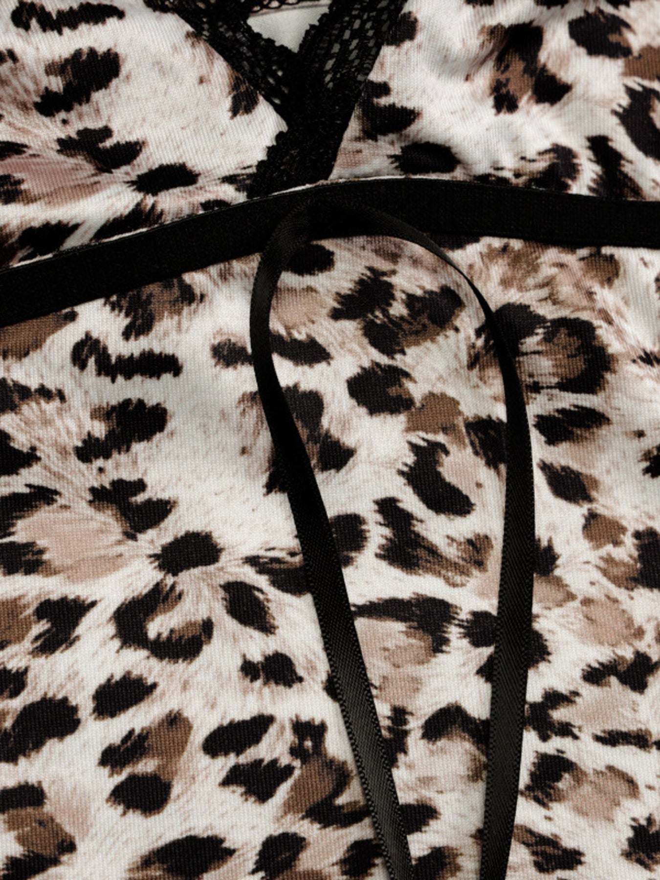 Leopard print cami with black lace-trim neckline and thin spaghetti straps