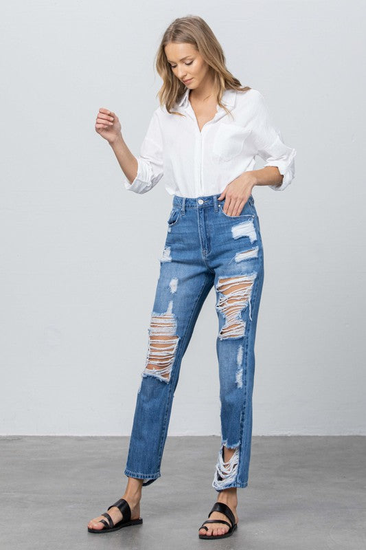 Straight-leg high-rise jeans, medium wash with large patch rips on thighs and knee