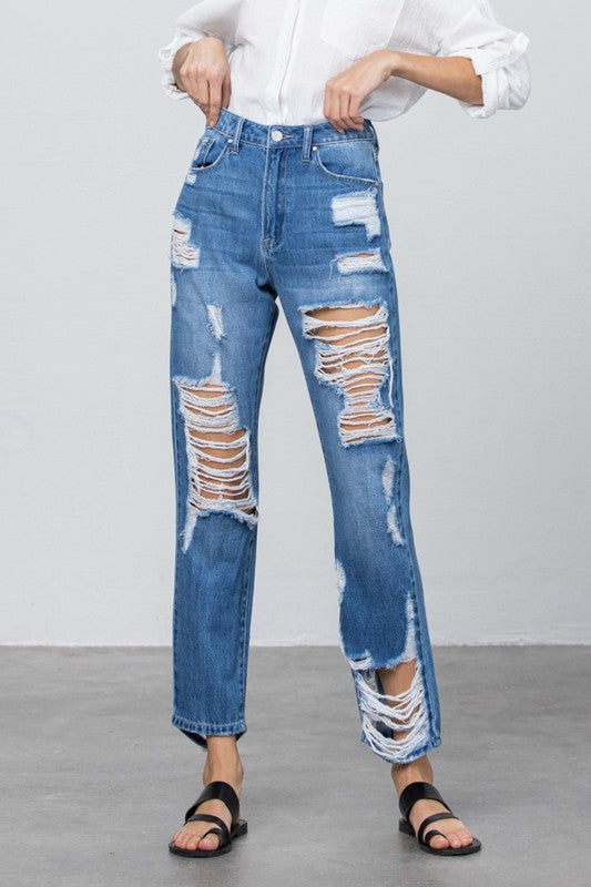 Close-up high-rise straight jeans: medium wash with shredded rip detailing on front