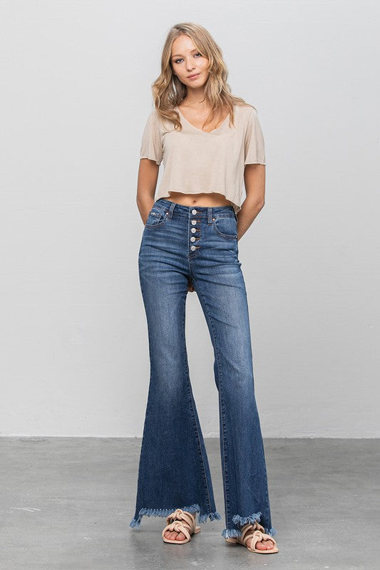 Dark wash wide flare jeans with front buttons and distressed frayed hem