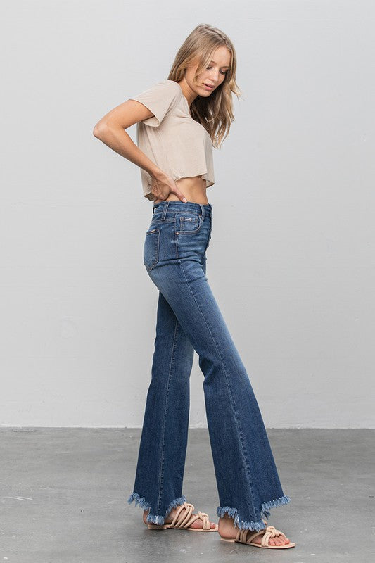 Dark flare jeans with button front and frayed hem, wide leg silhouette