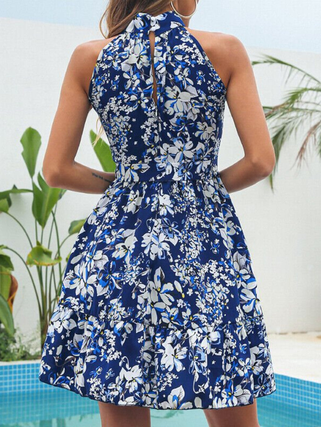 Navy floral halter mini dress, back keyhole opening and ruffled tier details
