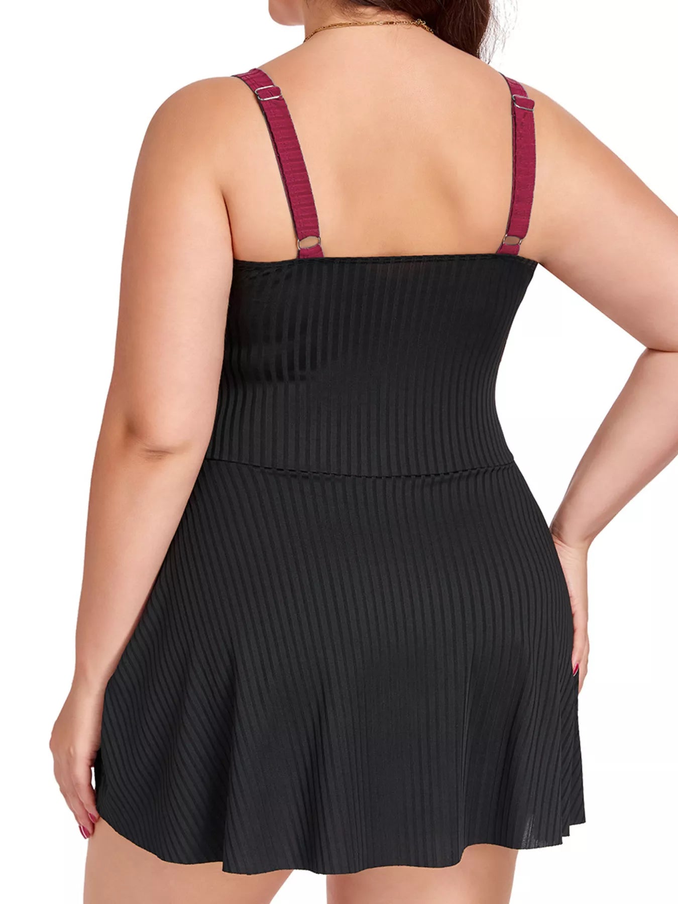 Plus Size ruched one-piece swim dress, black back view with tie-ruffle detail at hem