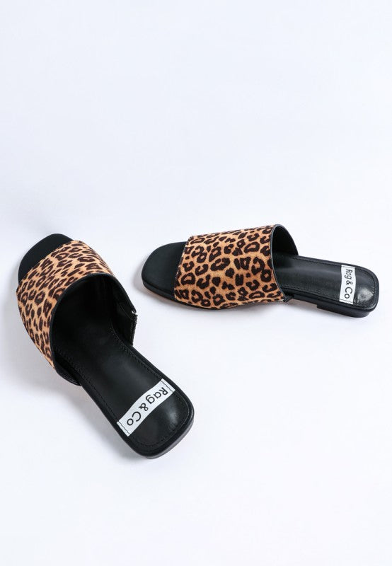Black slide sandals with leopard print upper and open wide toe