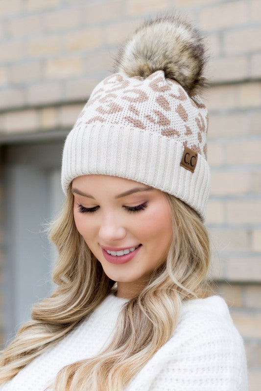 Beige Leopard Fur Pom Beanie with leopard print knit and light faux-fur pom