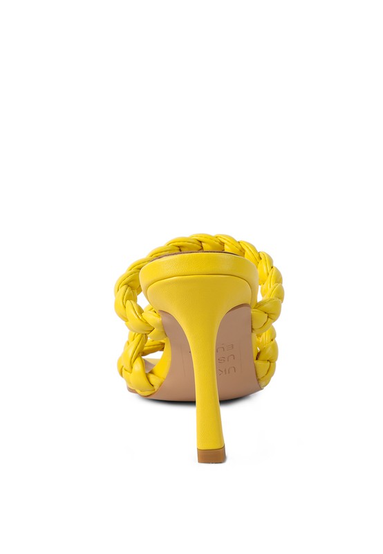 Yellow braided mules with pointed stiletto heel and back strap detail