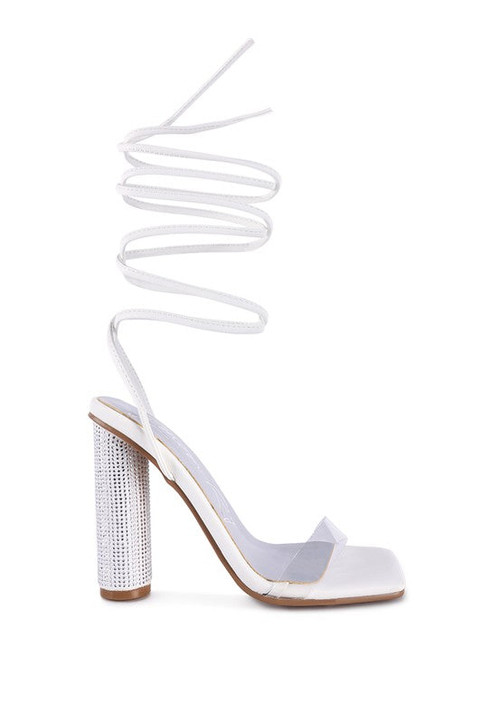 White lace-up high heel sandals with open toe and glossy rhinestone-style heel