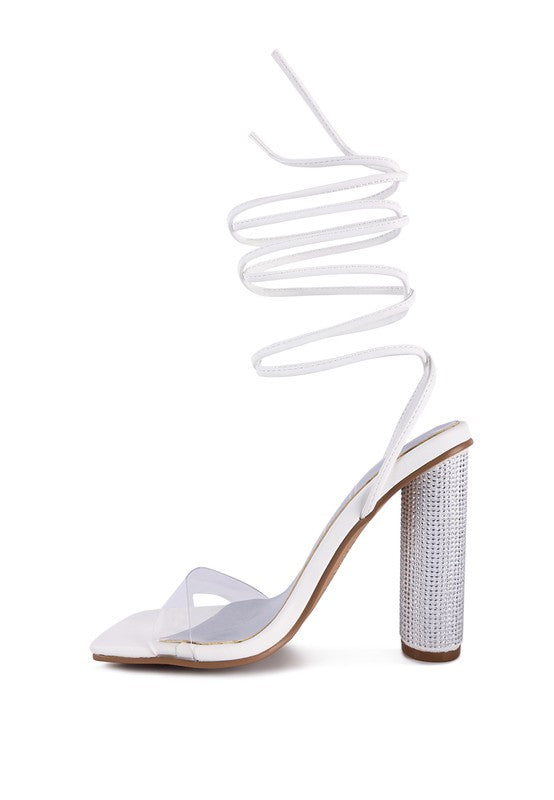 White lace-up high heel sandals from front side view with tall jeweled heel