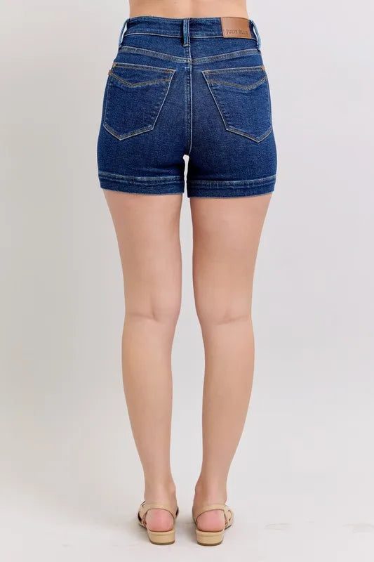 Dark blue denim shorts, back view with patch pockets and high-rise waistband