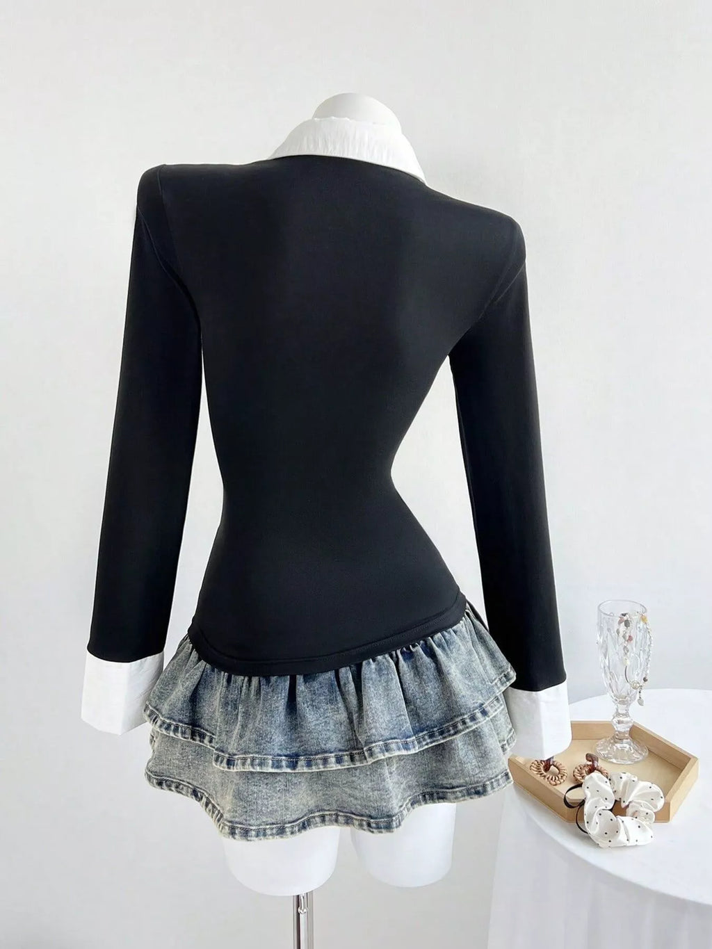 Black slim-fit long-sleeve polo shirt, back view with pointed collar