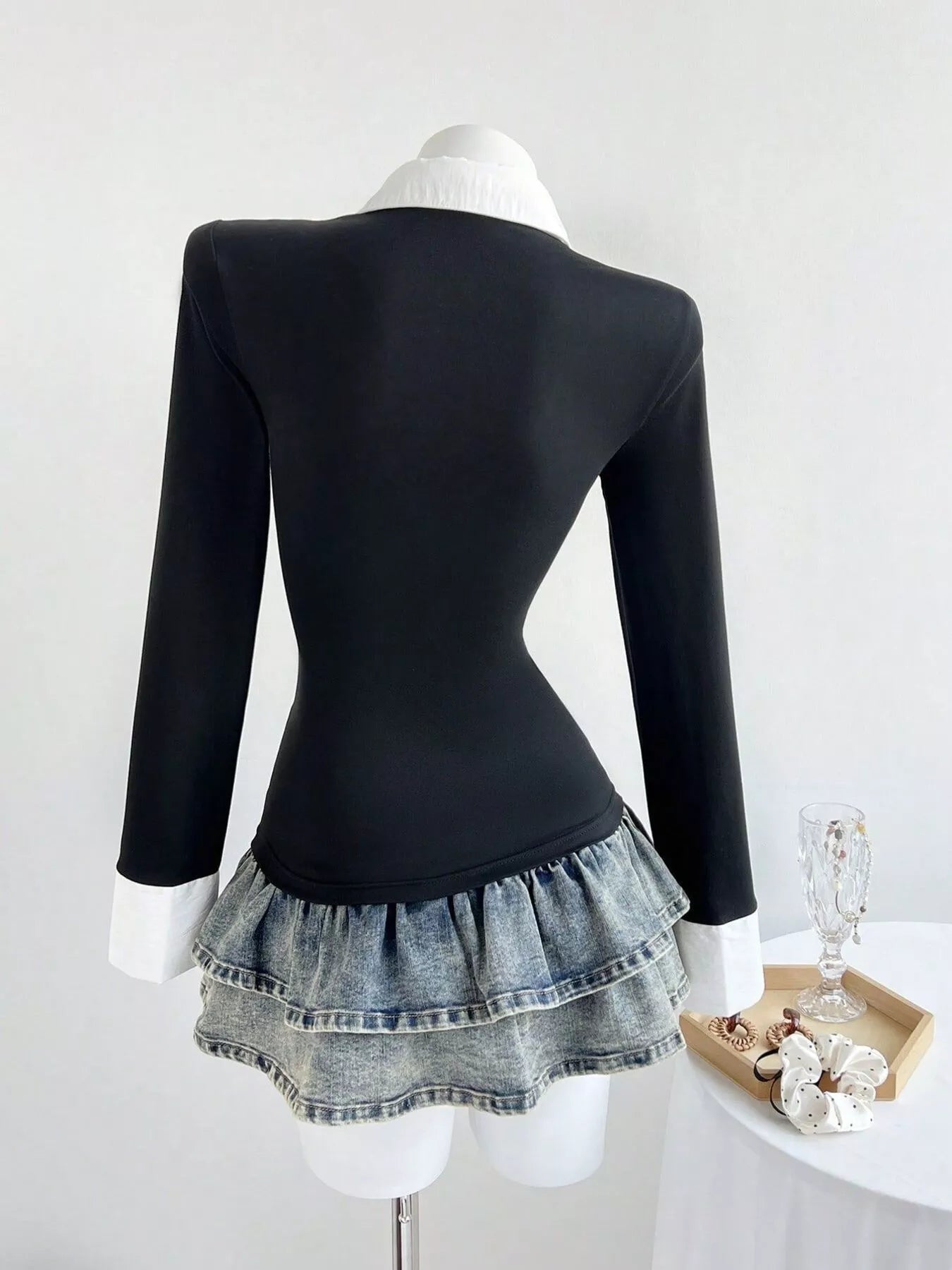 Black slim-fit long-sleeve polo shirt, back view with pointed collar