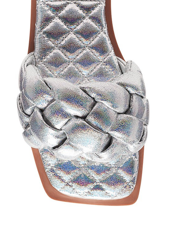 Close-up of silver quilted patent PU slide with braided knot strap