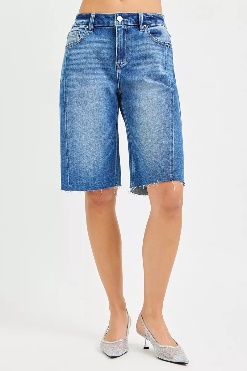 Slouchy seamed jorts in medium wash denim, wide leg fit, raw frayed hem, button fly