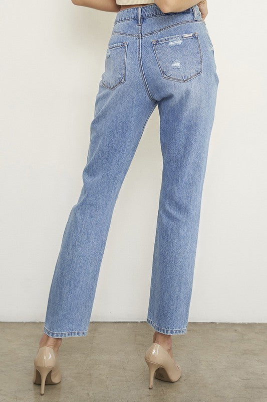 High-rise distressed girlfriend jeans, medium wash, back view of pockets and straight leg