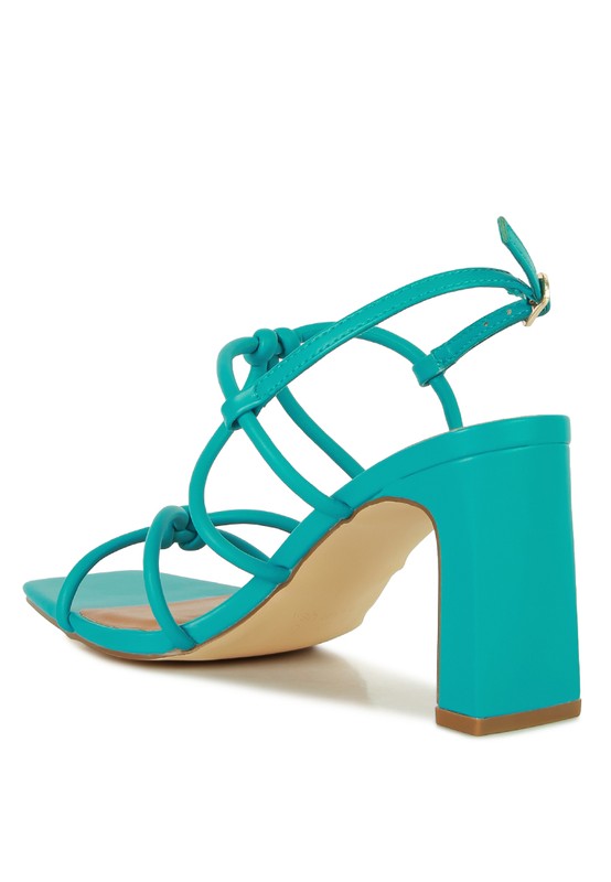 Teal strappy block heel sandal with knotted crossover straps and chunky heel