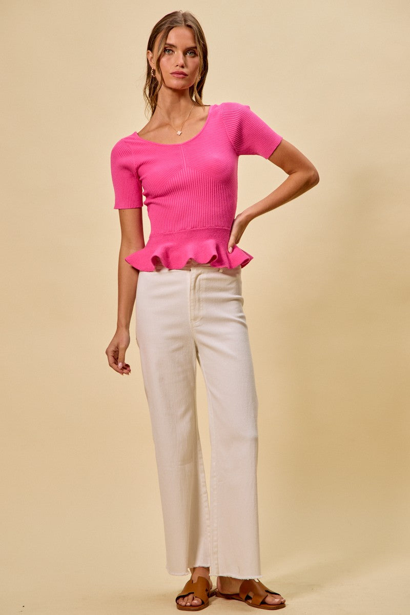 Hot pink peplum sweater top, ribbed knit texture and ruffled waist hem