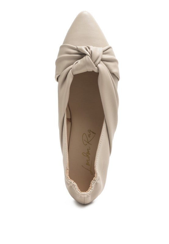 Cream ballet flats top view featuring a tied knot detail across the vamp
