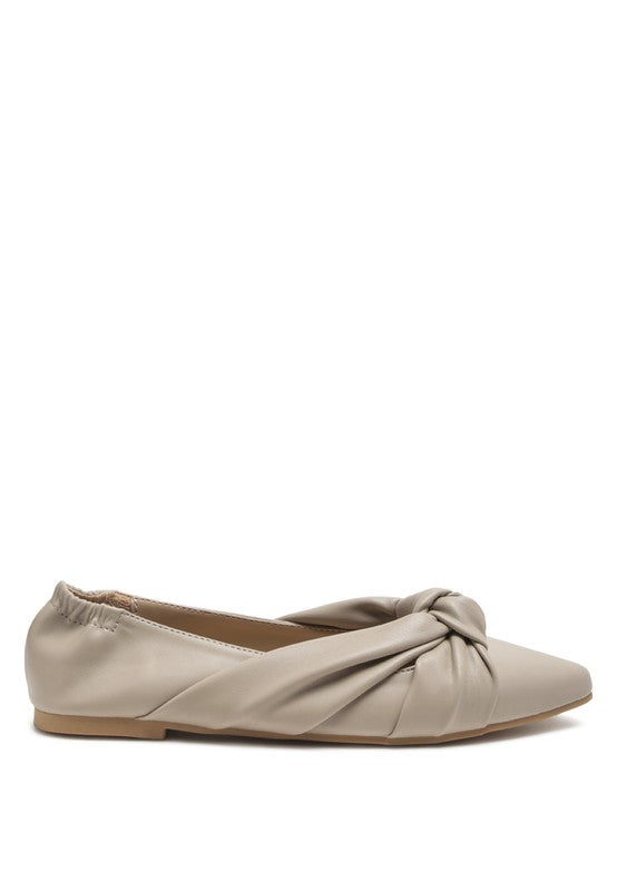 Cream ballet flats with front knot detail and elastic opening, side view