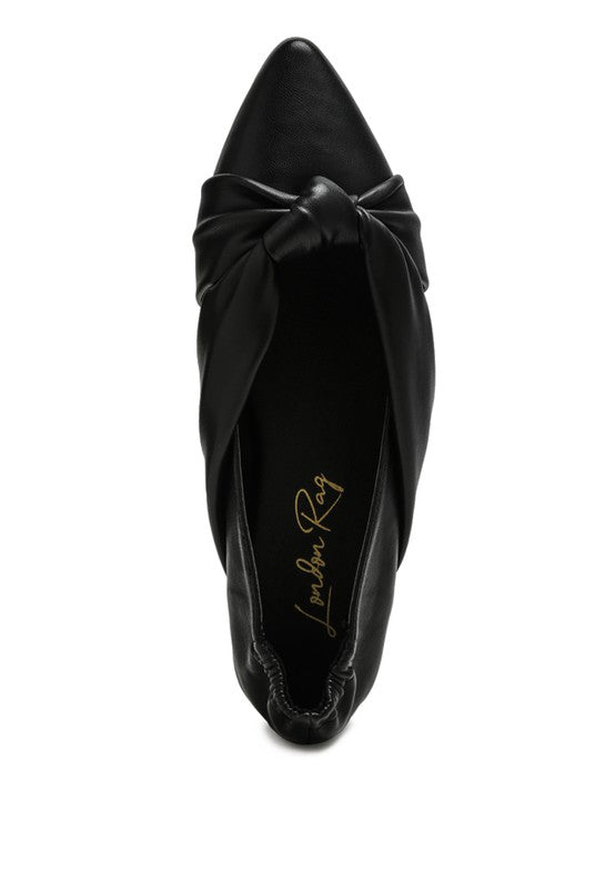 Black ballet flats with knotted bow detail at the vamp