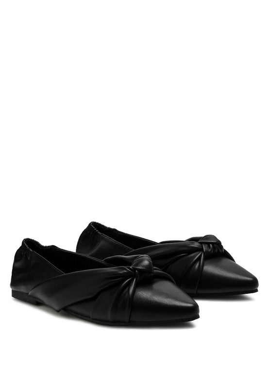 Black ballet flats with front knot detail and elastic collar, side view