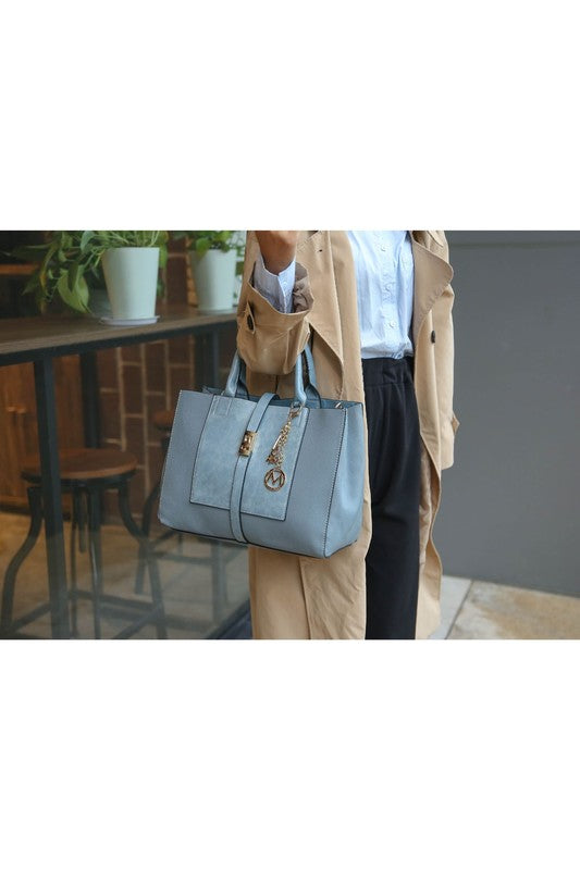 Denim Blue Yola satchel with front flap pocket and included wallet, worn by model