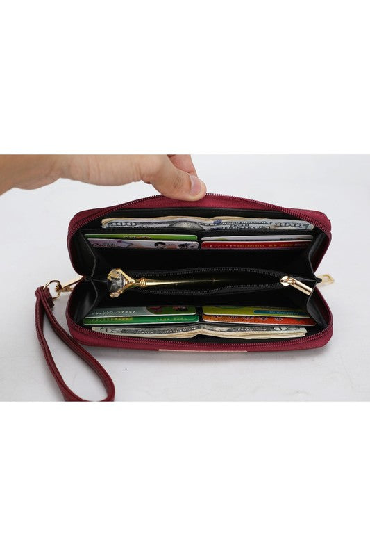 Open burgundy zip tote with organized interior and multiple card slots visible