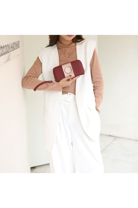 Small top-handle crossbody/tote clutch in burgundy with gold logo medallion and strap