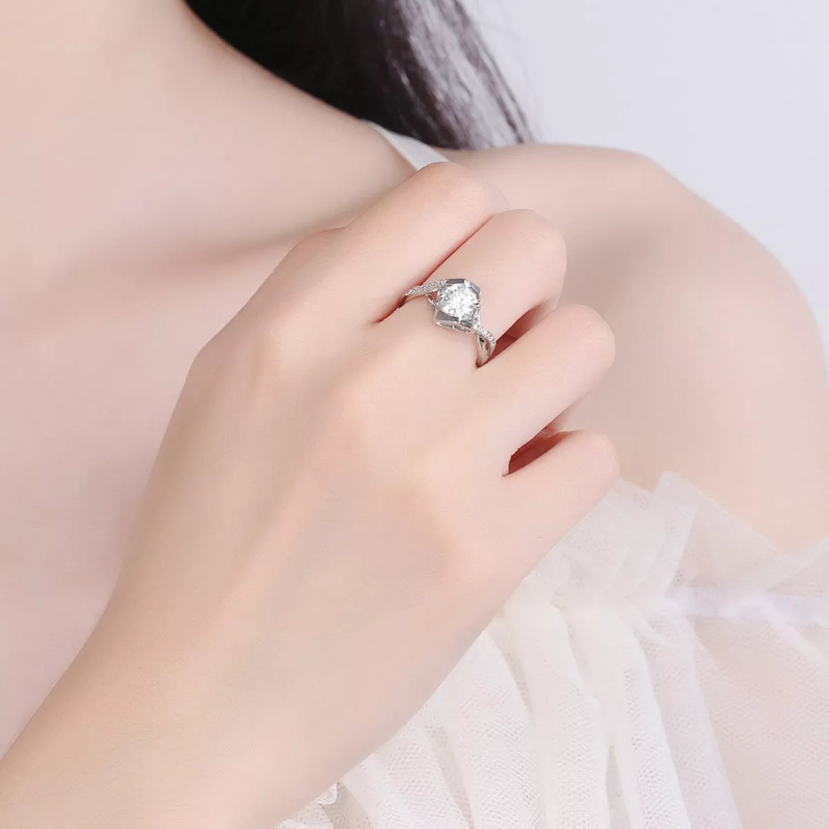 925 sterling silver moissanite ring on finger with square halo and sparkling side details