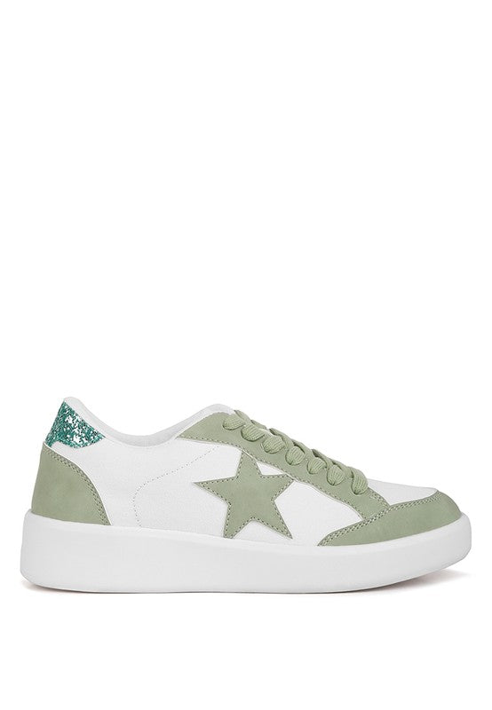 White Perry sneakers with green star, green suede side panels, and glitter heel trim