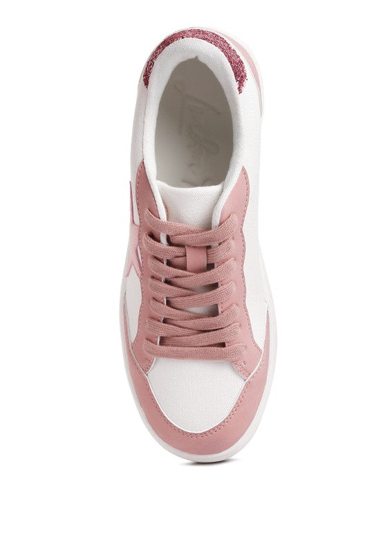 Side view of pink-and-white Perry sneakers with glitter collar and lace-up closure