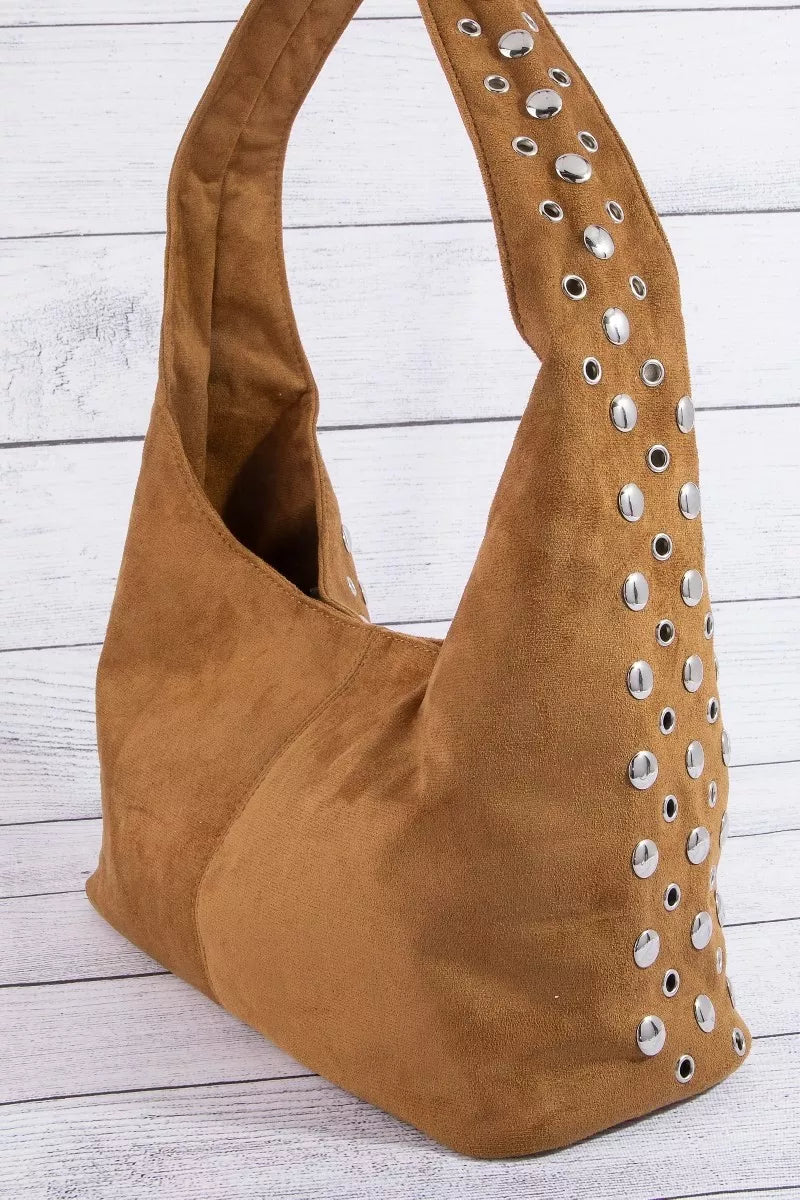 Suede shoulder bag with long handles and silver rivet detail along the side