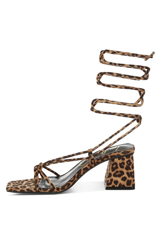 Leopard print square-toe heeled sandal showing side profile and block heel