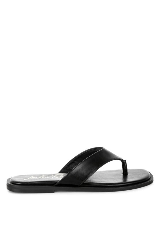 Black toe-post thong flats with curved T-strap and cushioned-looking footbed
